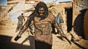 Philistine town Market Square; Abimelech (FINTAN MCKEOWN) and Phicol (KHALID BEN CHAGRA) want Samson (NONSO ANOZIE) killed. Samson fights back with great strength.