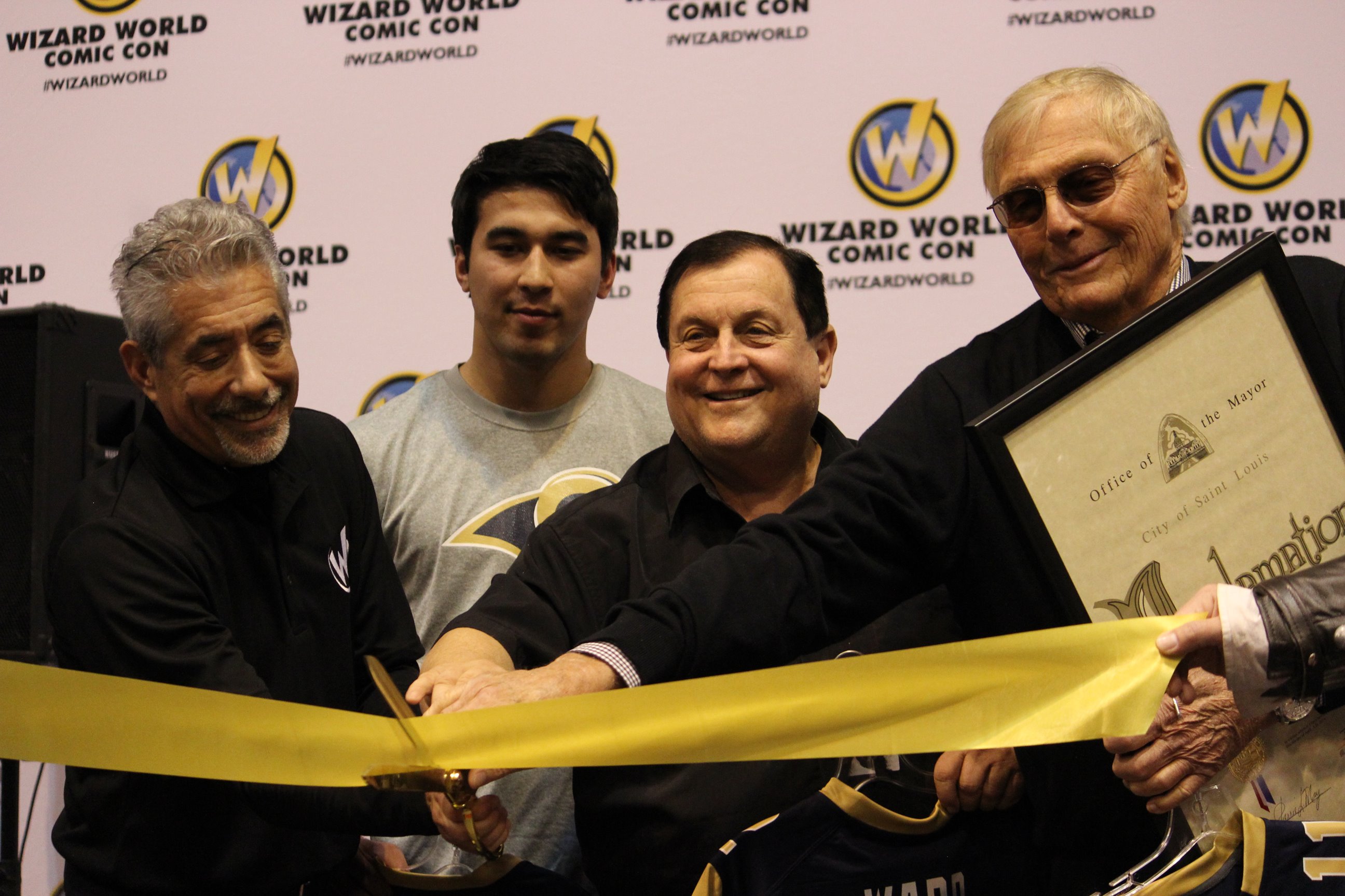Adam West (Batman) and Burt Ward (Robin) cutting the ribbon for the proclamation that April 4, 2014 was Batman and Robin Day in St. Louis.